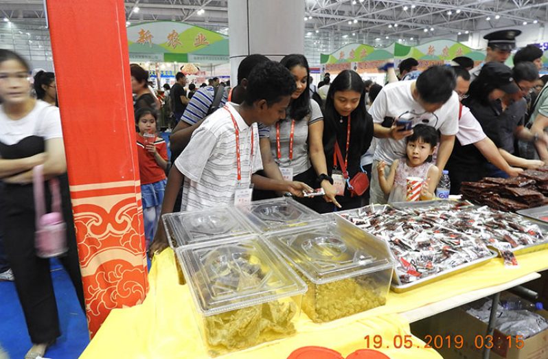 Students of the Marian Academy viewing a booth at the CFET fair in China