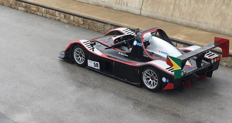 Mark Vieira’s Radical goes down the pit lane.