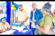Minister of Labour Hon. Joseph Hamilton engaging with the various booths during the ministry’s market day (Shaniece Bamfield photos)