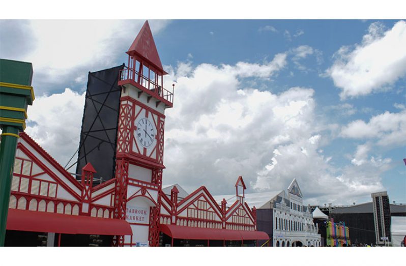 A replica of Guyana's Stabroek Market towers over the Avenue of the Caribbean at the Grand Market at the Queen's Park Savannah. This edifice houses the craft and art merchandise brought by the participating countries (Vishani Ragobeer photo)