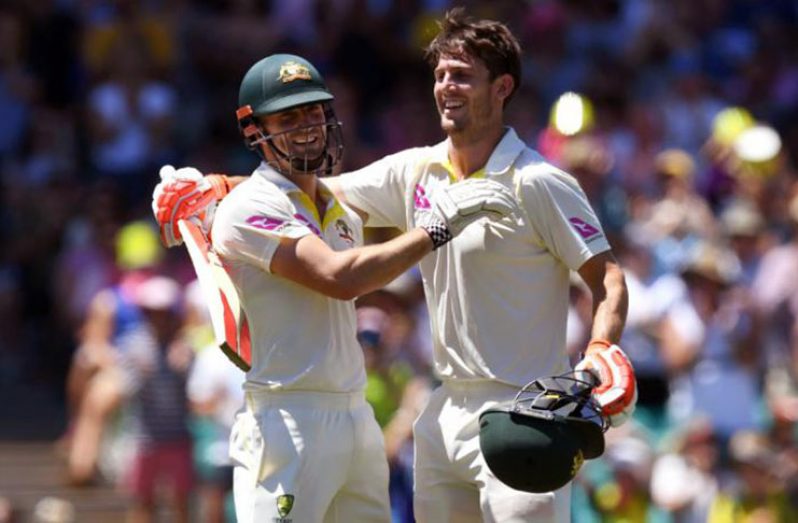 Coach Justin Langer backs 'attractive commodity' Mitchsll Marsh (right) ahead of Boxing Day Test. |