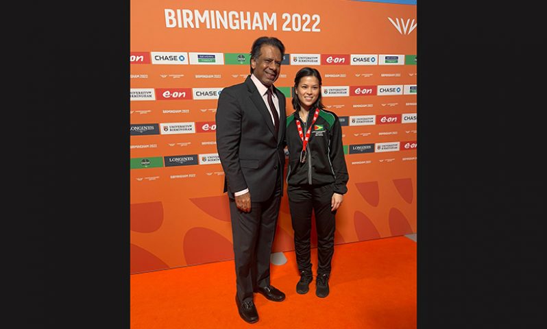 Guyana’s Mary Fung-A-Fat and badminton legend Jahangir Khan after receiving her Women’s Plate second-place medal