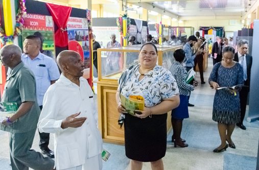 Former Mayor Hamilton Greene, interacting with an official during the exhibition viewing