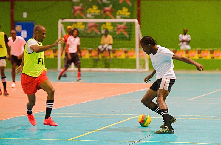 Action in the Magnum Mash Futsal Cup at the National Gymnasium.