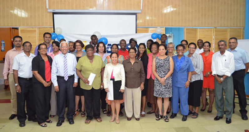 Country Manager Mr. Deo Persaud (with tie) and senior managers pose with representatives of the 24 organisations