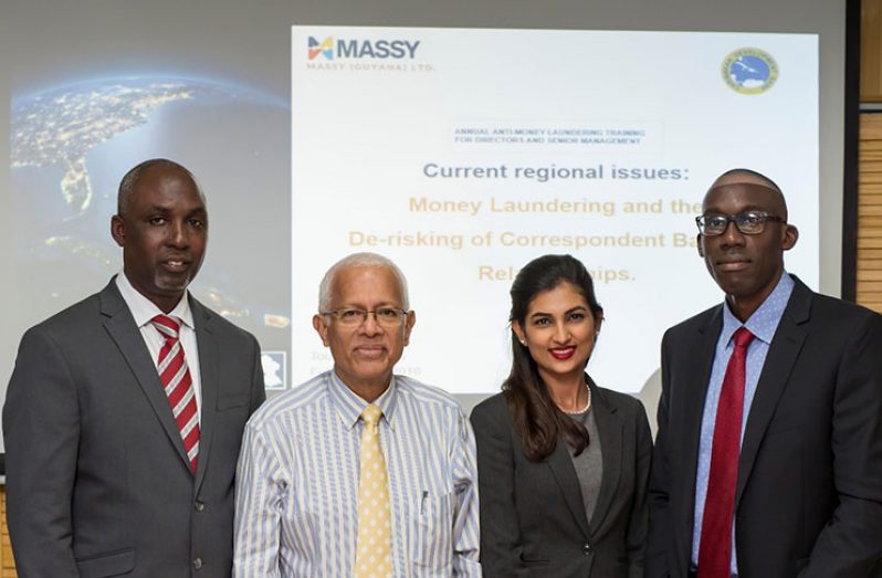 From left to right: Director of FIU Matthew Langevine, Chairman of Massy Guyana Deo Persaud, Group Corporate Legal Adviser, Compliance Officer and Corporate Secretary Yolander Persaud and Dr Toussaint Boyce