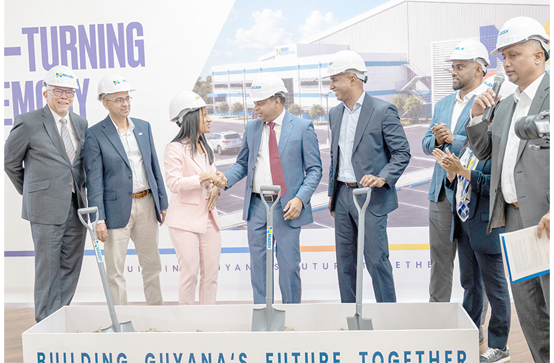 Minister of Public Utilities and Aviation, Deodat Indar, flanked by Massy officials during the sod turning ceremony at Massy Montrose, East Coast Demerara (Elton John photo)