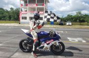 Matthew Vieira displays his chequered flag