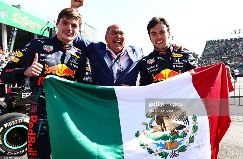 Race winner, Max Verstappen, of the Netherlands and Red Bull Racing and third placed, Sergio Perez, of Mexico and Red Bull Racing celebrate in parc ferme during the F1 Grand Prix of Mexico at Autodromo Hermanos Rodriguez on November 07, 2021 in Mexico City, Mexico (Photo by Mark Thompson/Getty Images)