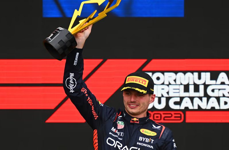 Max Verstappen lifts the Canadian trophy