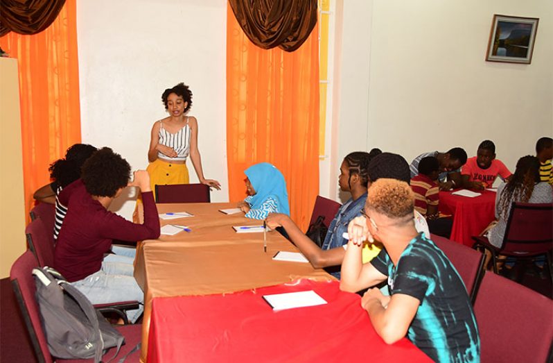 Self-published author, Maya Collins, as she interacts with the participants on Tuesday