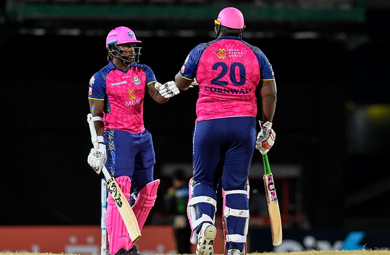 Kyle Mayers (L) and Rahkeem Cornwall (R) of Barbados Royals 50 runs partnership during the Men's 2023 Republic Bank Caribbean Premier League match 10 between Saint Kitts and Nevis Patriots and Barbados Royals at Warner Park Sporting Complex on August 26, 2023 in Basseterre, Saint Kitts and Nevis. (Photo by Randy Brooks/CPL T20 via Getty Images)