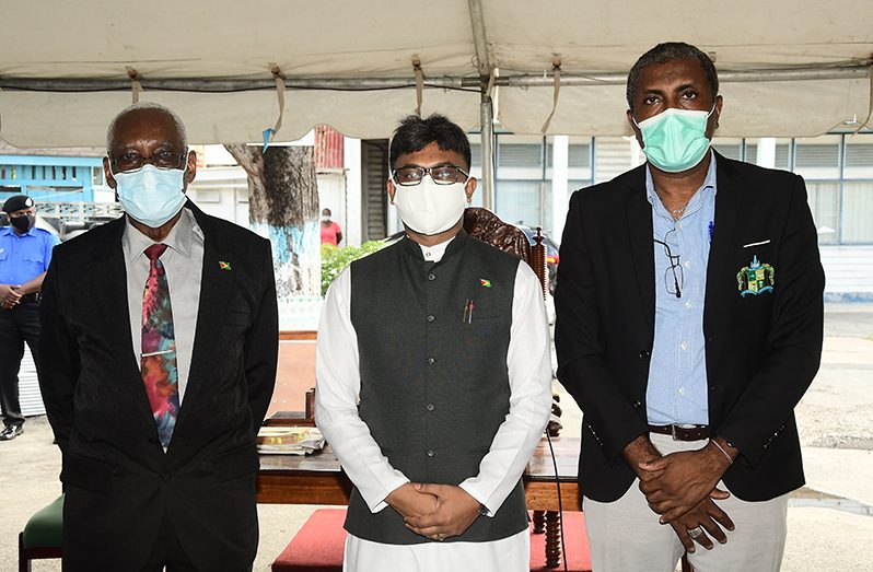 Mayor Ubraj Narine (centre); Deputy Mayor, Alfred Mentore (right) and Chairman of the Finance Committee, Oscar Clarke (left) following their re-election