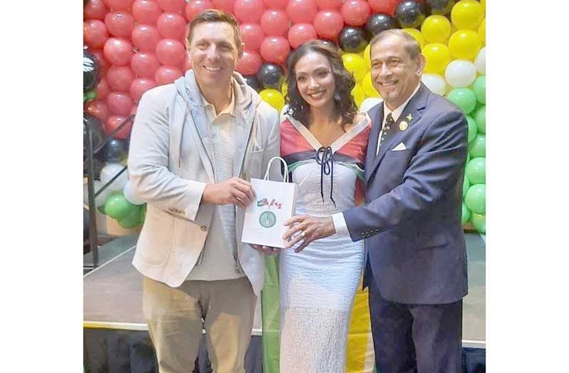 Mayor Patrick Brown, left, with Honorary Consul Mani Singh and another guest