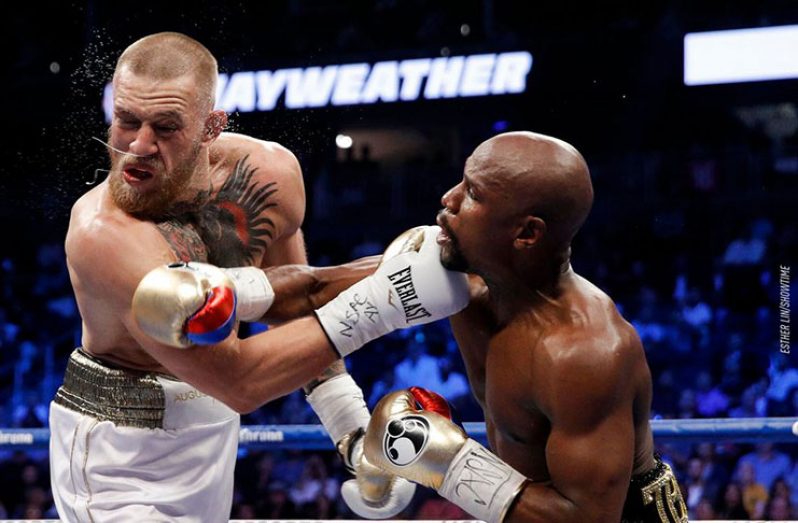 Conor McGregor (left) after catching a punch to the face during his fight with Floyd Mayweather.