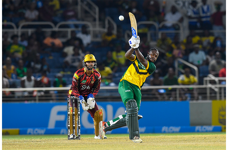 Kirk McKenzie (R) of Jamaica Kingsmen hits 4 and Nicholas Pooran (L) of Trinbago Knight Riders watch during the Men's 2026 Republic Bank Caribbean Premier League match 8 between Jamaica Kingsmen and Trinbago Knight Riders at Sabina Park on August 15, 2026 in Kingston, Jamaica (Photo by Randy Brooks/CPL T20)