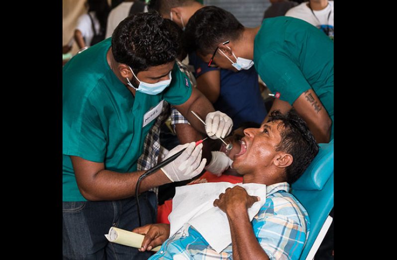 Medical personnel attending to a resident of one of the villages during the outreach