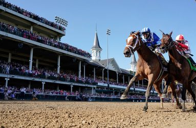 Medina Spirit #8, ridden by jockey John Velazquez, crosses the finish line to win the 147th running of the Kentucky Derby ahead of Mandaloun #7, ridden by Florent Geroux, and Hot Rod Charlie