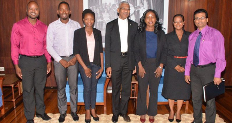 From left, Mr. Dmitri Nicholson, Chairman of the National Coordinating Coalition Incorporated;  Mr. Leroy Adolphus, Policy and Advocacy Officer, Guyana Civil Society Leadership (GCSL) Project; Ms. Leeana Allen, Monitoring and Evaluation Officer, GCSL; President David Granger; Ms. Goldie Scott, Chief Executive Officer, Volunteer Youth Corps; Ms. Simone Sills, Programme Manager, GCSL; and Mr. Brian Pertab, Resource Mobilisation Officer  
(Ministry of the Presidency photo)