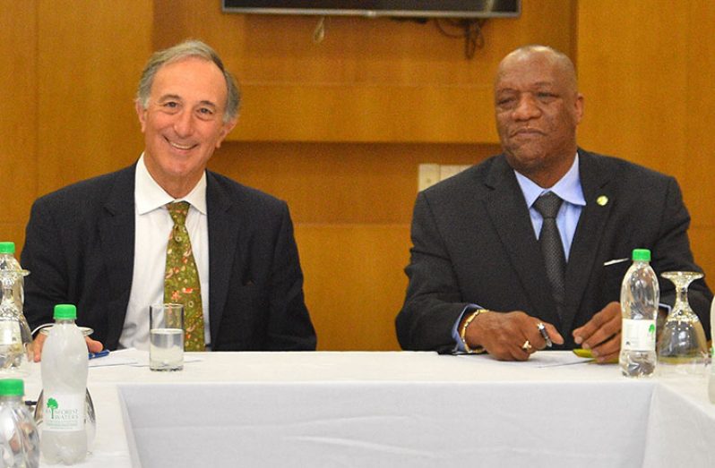 Conservation International Chairman, Mr Peter Seligmann (left) and Minister of State Joseph Harmon at the Marriott meeting on Monday