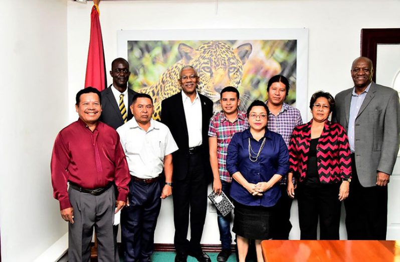 From left (second row): Commissioner of the Guyana Lands and Surveys Commission, Mr. Trevor Benn; President David Granger; Mr. Ted Lucas, Mr. Ron James, Ms. Jean La Rose and Minister of State, Mr. Joseph Harmon. Front row: Mr. Earl Thomas, Mr. Benson Thomas and Ms. Laura George.