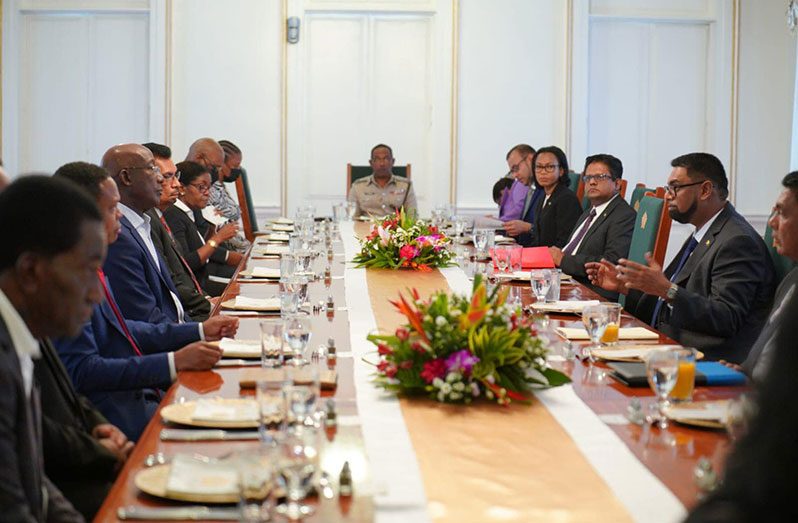 The President of Guyana, Dr. Irfaan Ali along with high-level government officials in discussion with Prime Minister of Trinidad and Tobago, Dr. Keith Rowley and his team of senior officials at State House, on Tuesday (Office of the President photo)