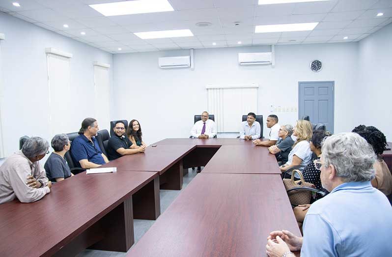 Minister of Health Dr Frank Anthony in discussion with the team from Louisiana’s Tulane University