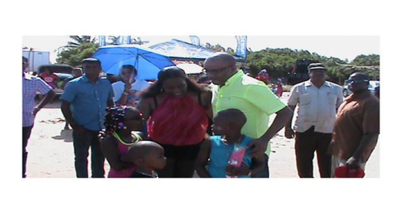 Former President Bharrat Jagdeo enjoying a rare visit to the beach on Easter Monday on the Essequibo Coast