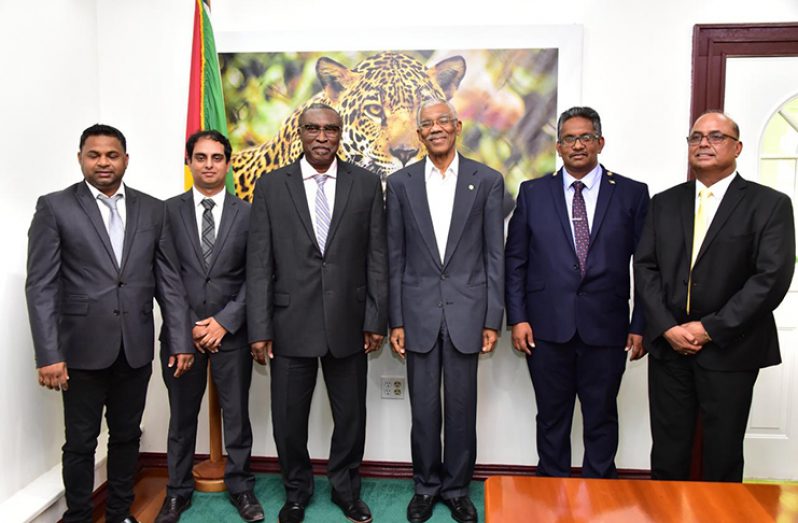 President David Granger (fourth left) alongside officials of the Private Sector Commission (PSC photo)