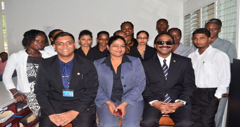 Attorney-General and Minister of Legal Affairs, Mr Basil Williams (seated right); with Registrar of Deeds Registry, Ms Azeena Baksh and Assistant Registrar, Ms Reza Manraj and other staff of the Berbice Deeds Registry