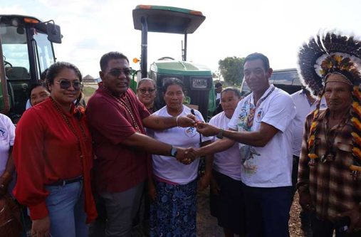 Minister Mustapha hands over keys to one of three new tractors delivered to Region Nine communities on Wednesday