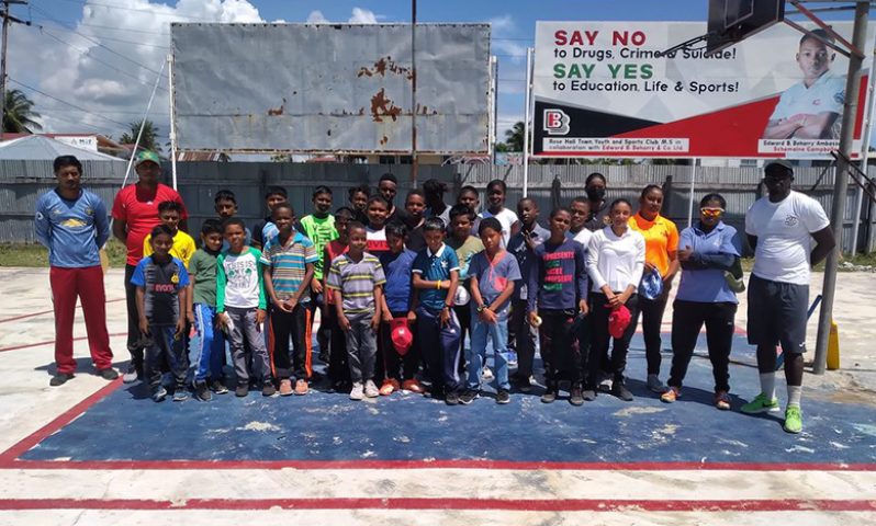 RHTYSC cricket coaches pose with members of the Kiddies Academy