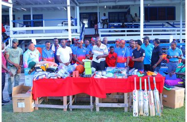 Members of Regal Stationery and Computer Centre and Regal Sports along with members of the Guyana Police Force Sports Section pose with the items. On the left of Regal Sports Manager, Ian John is Deputy Commissioner, Administration, Ravindradth Budhram, while John Ramsingh is fourth from left ‎