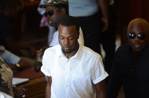 The defendants, from left, Carlos Bacchus and Troy Peters