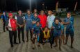 Prime Minister Mark Phillips, Minister Juan Edghill and other officials pose with 2025 'One Guyana' Kings of the Sand champions, LA Ballers