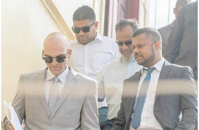 Nazar and Azruddin Mohamed pictured with their attorneys, Siand Dhurjon and Damien Da Silva at the Georgetown Magistrates’ Courts (Delano Williams photo)