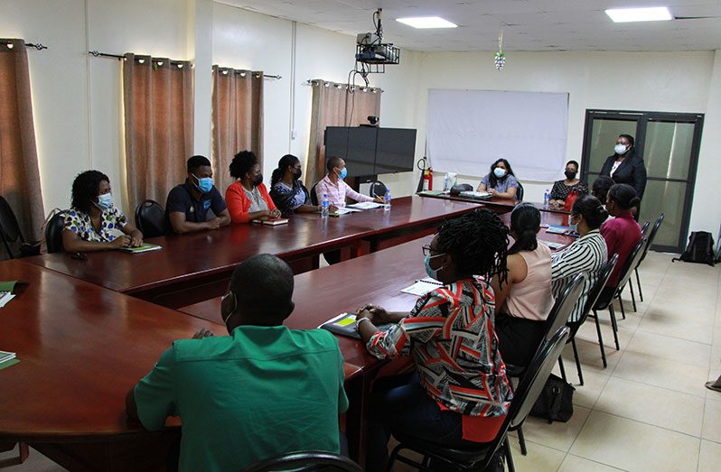 Healthcare workers during the training session at the Mental Health Unit. Standing is Director of the Mental Health Unit, Dr. Util Thomas