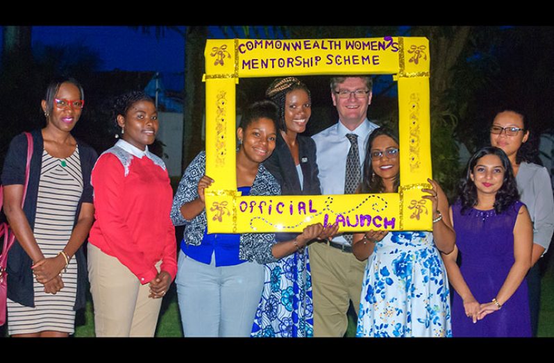 British High Commissioner Greg Quinn poses with a few of the Guyanese mentees
