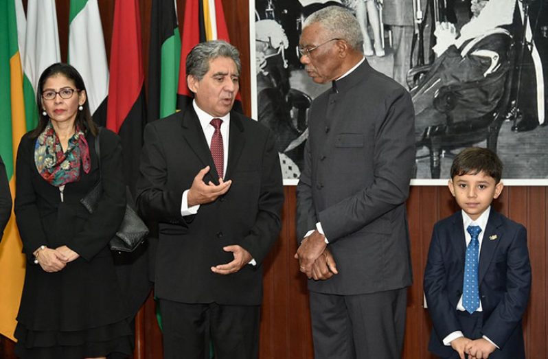 President David Granger pays keen attention to José Omar Hurtado Conteras, Ambassador of the United Mexican States to Guyana. Also photographed are the ambassador's wife and son
