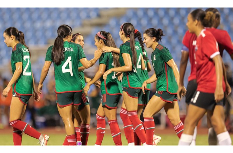 Mexico celebrate a goal against Trinidad and Tobago.