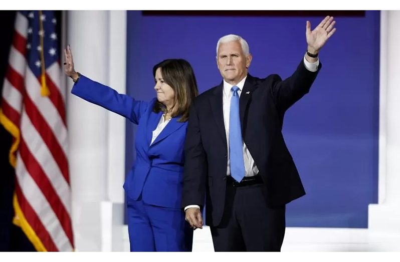 Mike Pence waves after announcing his withdrawal from the race