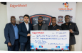From L-R Head of Referees Tyrone Tyrrell, GFF GS Pushpargha Chattopadhyay, ExxonMobil Guyana's Ryan Hoppie, VMFA Director Vurlon Mills, and Assistant Director of Sport Franklin Wilson with ExxonMobil’s sponsorship cheque