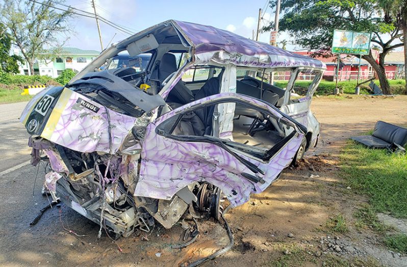 The mangled remains of the minibus was still at the scene of the accident on Thursday