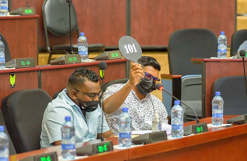 A miner placing a bid on one of the mining blocks up for grabs on Saturday at the Guyana Geology and Mines Commission (GGMC) 2021 Auction (Delano Williams photo)