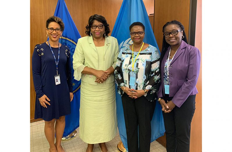 Minister Lawrence (third left) flanked by Dr Carissa Etienne, PAHO Director,
on her immediate right and Dr Karen Gordon-Campbell on her left and another
official at extreme left
