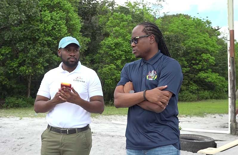 Minister Steven Jacobs and Minister Keoma Griffith meeting with residents at one of the community grounds
