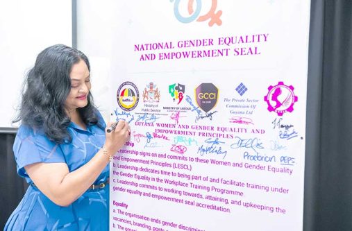 Minister of Human Services and Social Security, Dr Vindhya Persaud adds her signature to the Women and Gender Equality and Empowerment Principles.