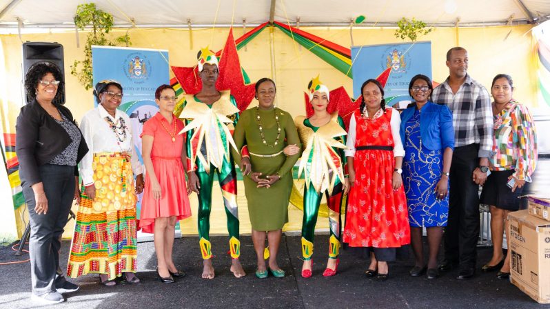 Minister of Education Nicolette Henry and other officals of the ministry of Education pose with revellers.