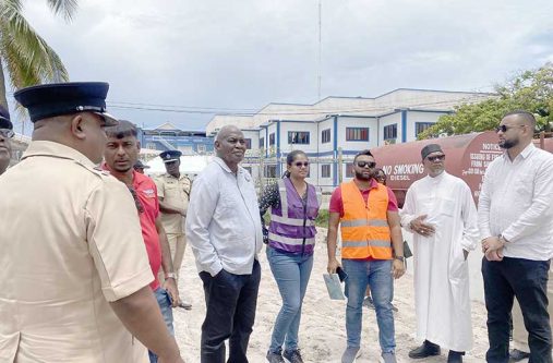 Minister of Home Affairs, Robeson Benn (centre), and Permanent Secretary Andre Ally engage with the contractor and engineers during a site visit to the Anna Regina Police Station project last Saturday.