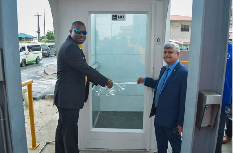 Minister of Public Infrastructure, Hon. David Patterson and Minister within the Ministry of Public Infrastructure, Hon. Jaipaul Sharma, commissioned the elevators at the Peters Hall overpass (DPI photo)